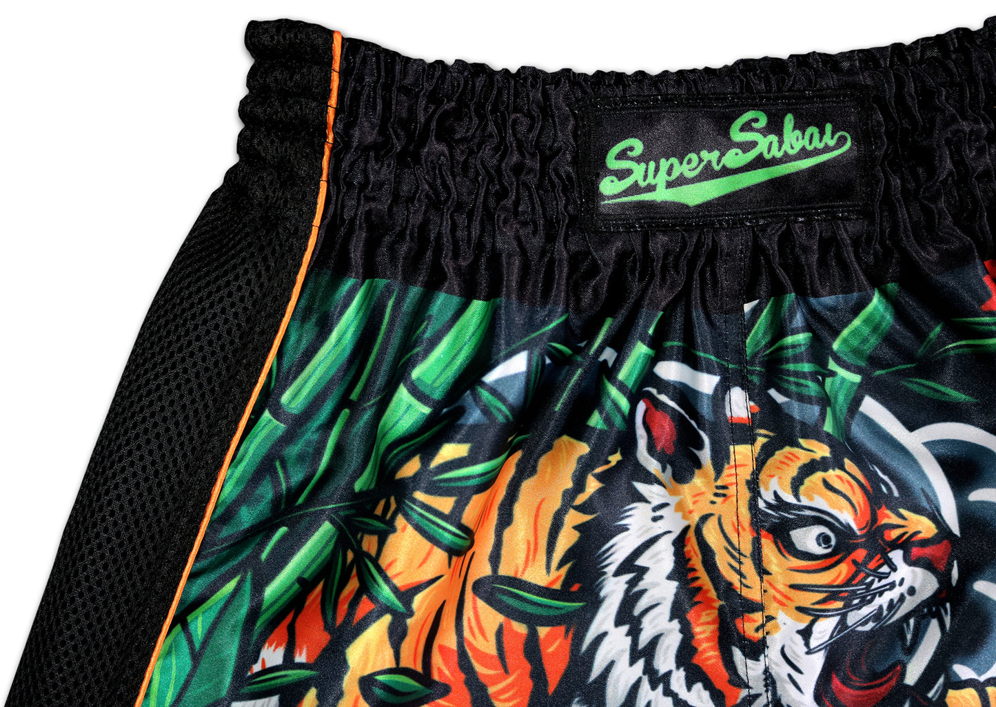 Close-up of Irezumi Tiger Muay Thai Shorts showing the roaring tiger face, bamboo details, orange piping, and SuperSabai waistband β handmade in Thailand
