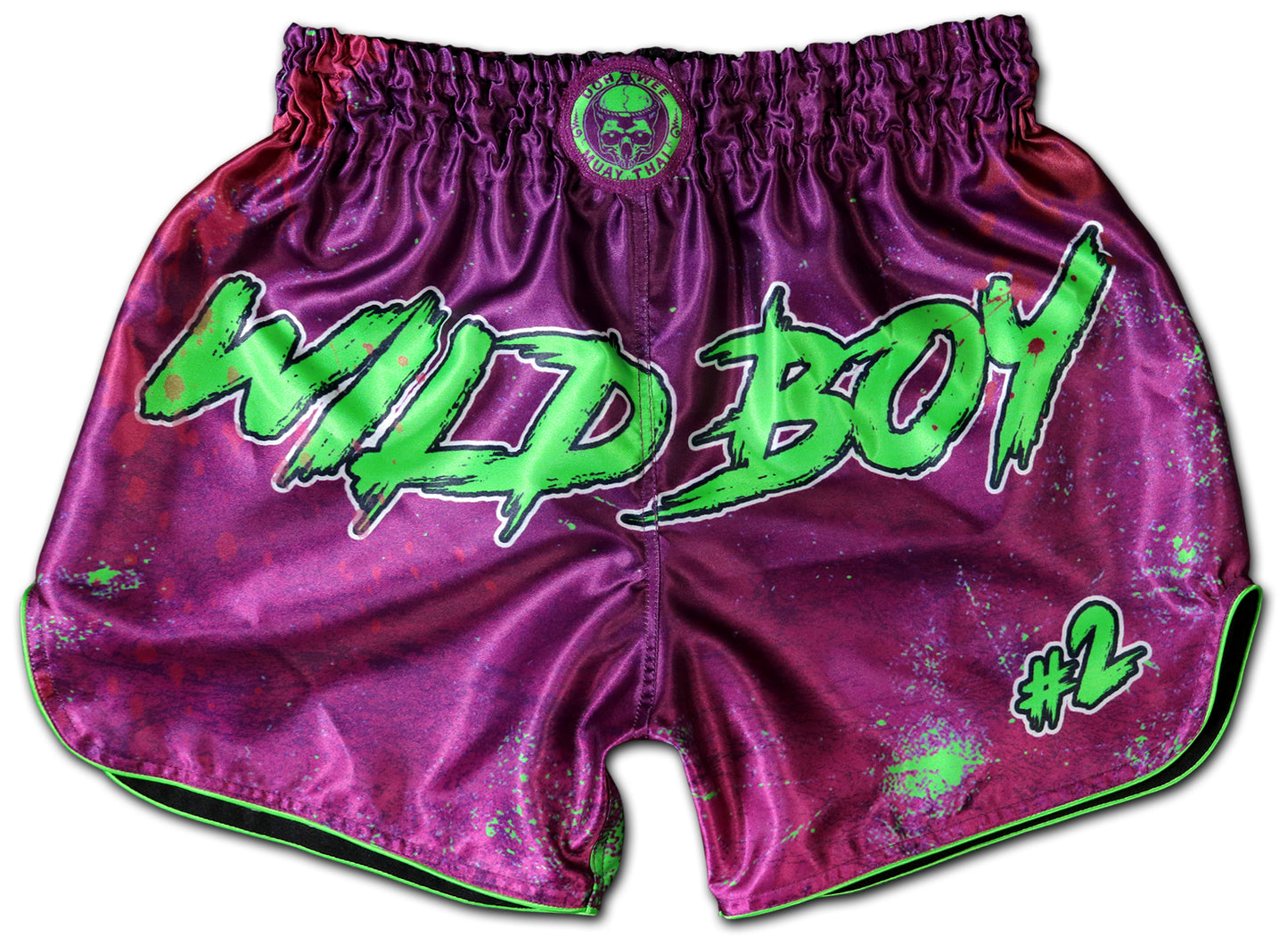 Wild Boy Muay Thai Shorts in shiny purple satin with neon green graffiti lettering, paint splatter design, elastic waistband, handmade in Thailand, customizable with name, extreme limited edition.