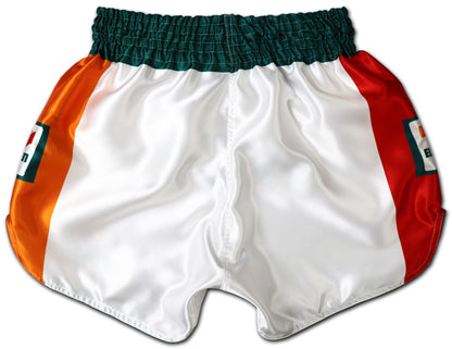 Back view of white Muay Thai shorts with green waistband and bold orange and red side panels featuring 7-Eleven logos.