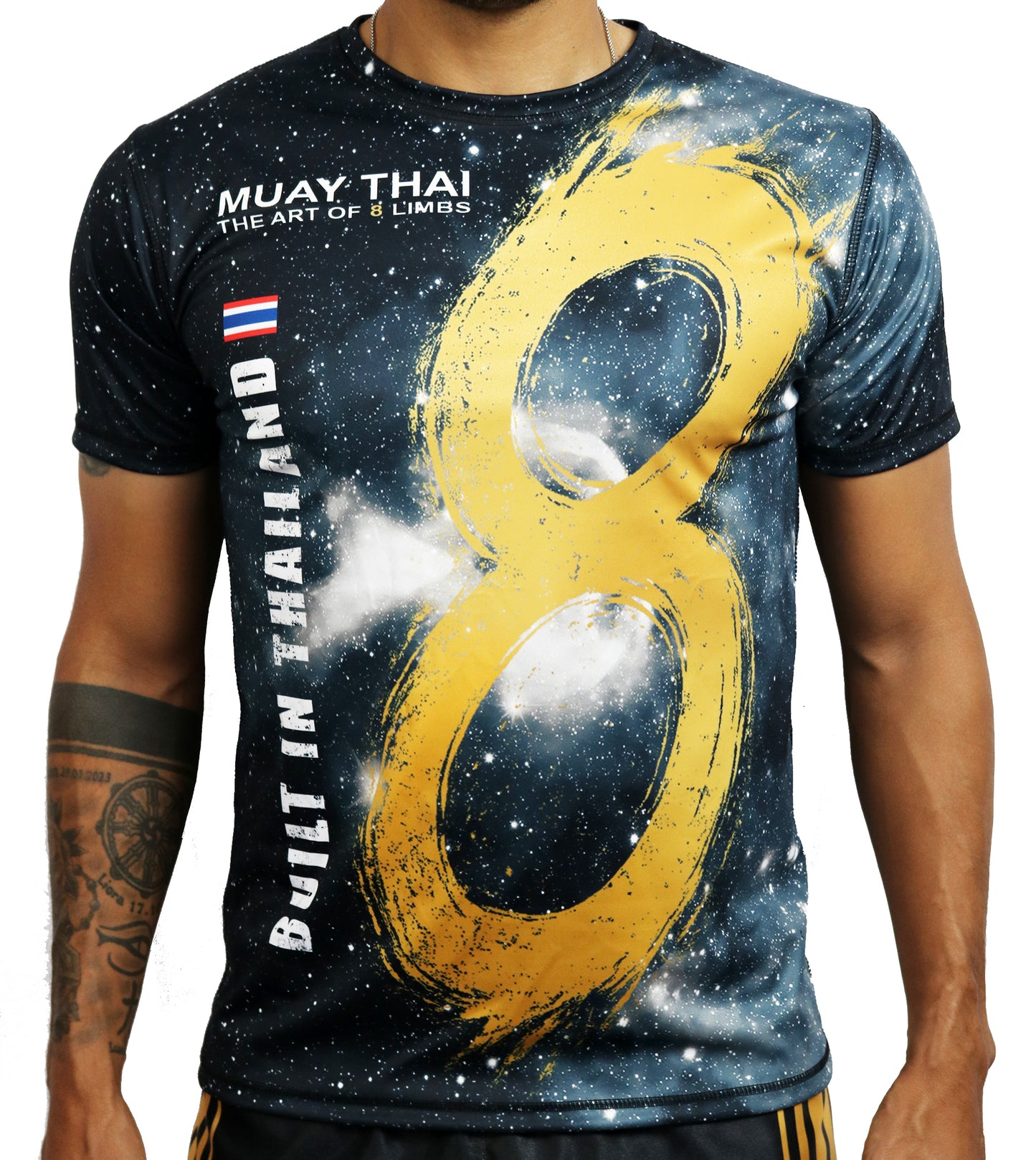 YAKSHA 8 Limbs Universe Muay Thai t-shirt worn by model, front view showing galaxy print with golden 8 symbol and Built in Thailand lettering