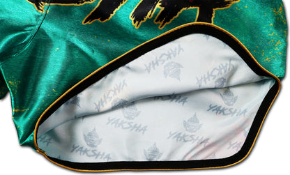 Inside view of YAKSHA Muay Thai Shorts GRUNGE showing premium satin lining with YAKSHA logo print, clean stitching and gold edge finish.