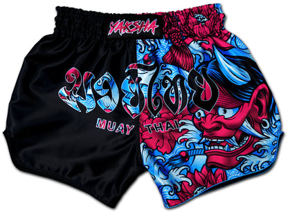 YAKSHA Muay Thai Shorts Luk Krʉng Black Oni two tone design in black, red, and blue with Oni demon artwork and YAKSHA logo, handmade in Thailand.