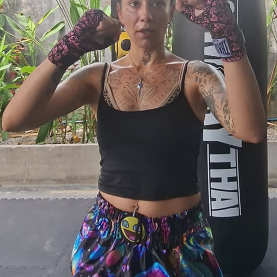 
Muay Thai Fighter is wearing the Magic Mushrooms Muay Thai shorts while Muay Thai training, shadow boxing, punching and kicking in the gym