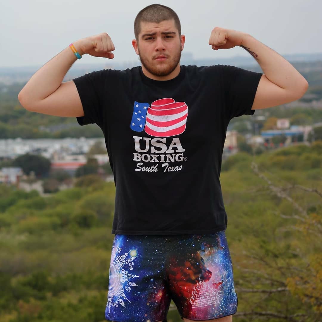 Fighter wearing Universe Galaxy satin shorts, blue and black galaxy print with sacred Thai Yantra symbols