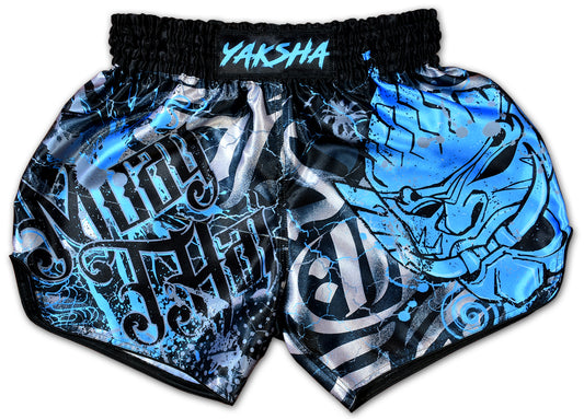 YAKSHA Demons Thai boxing shorts front view, black base with electric blue demon face and silver grunge lettering