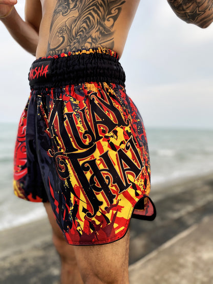 Close up of YAKSHA Firestarter Thai boxing shorts waistband with red YAKSHA logo and red orange fabric detail