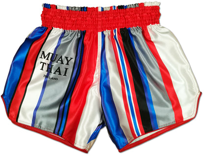 Beautiful Violence striped Thai boxing shorts front view, red elastic waistband, bold vertical stripes in red, white, blue, gray and black with MUAY THAI THAILAND lettering