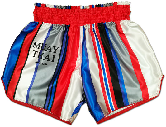 Beautiful Violence striped Thai boxing shorts front view, red elastic waistband, bold vertical stripes in red, white, blue, gray and black with MUAY THAI THAILAND lettering