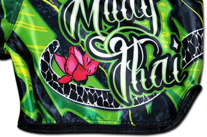Black Cobra Muay Thai Shorts close up from Muay Thai script with lotus blossom and cobra scales