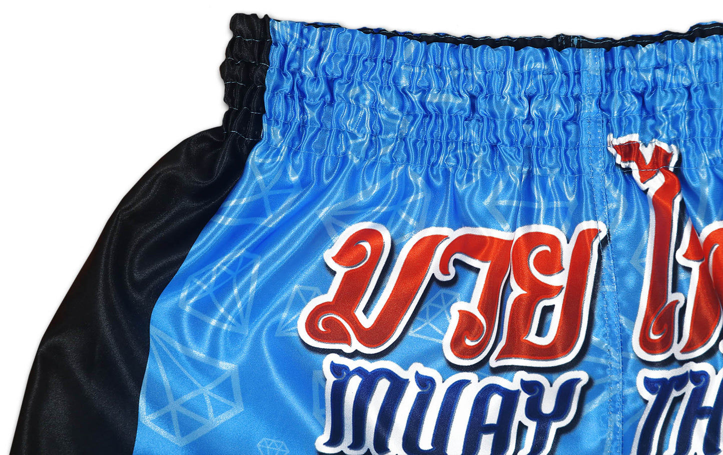 Detail of red and blue MUAY THAI lettering and Thai script on BLUE CORNER glossy blue diamond satin