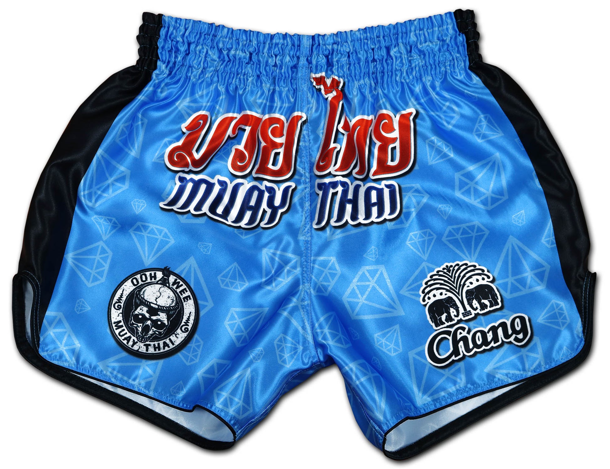 Blue Corner fight shorts front view, electric blue diamond satin with red Thai script, OOWEE skull badge and Chang elephant logo