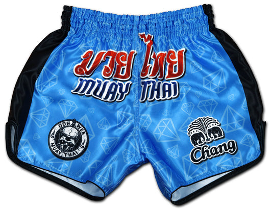 Blue Corner fight shorts front view, electric blue diamond satin with red Thai script, OOWEE skull badge and Chang elephant logo