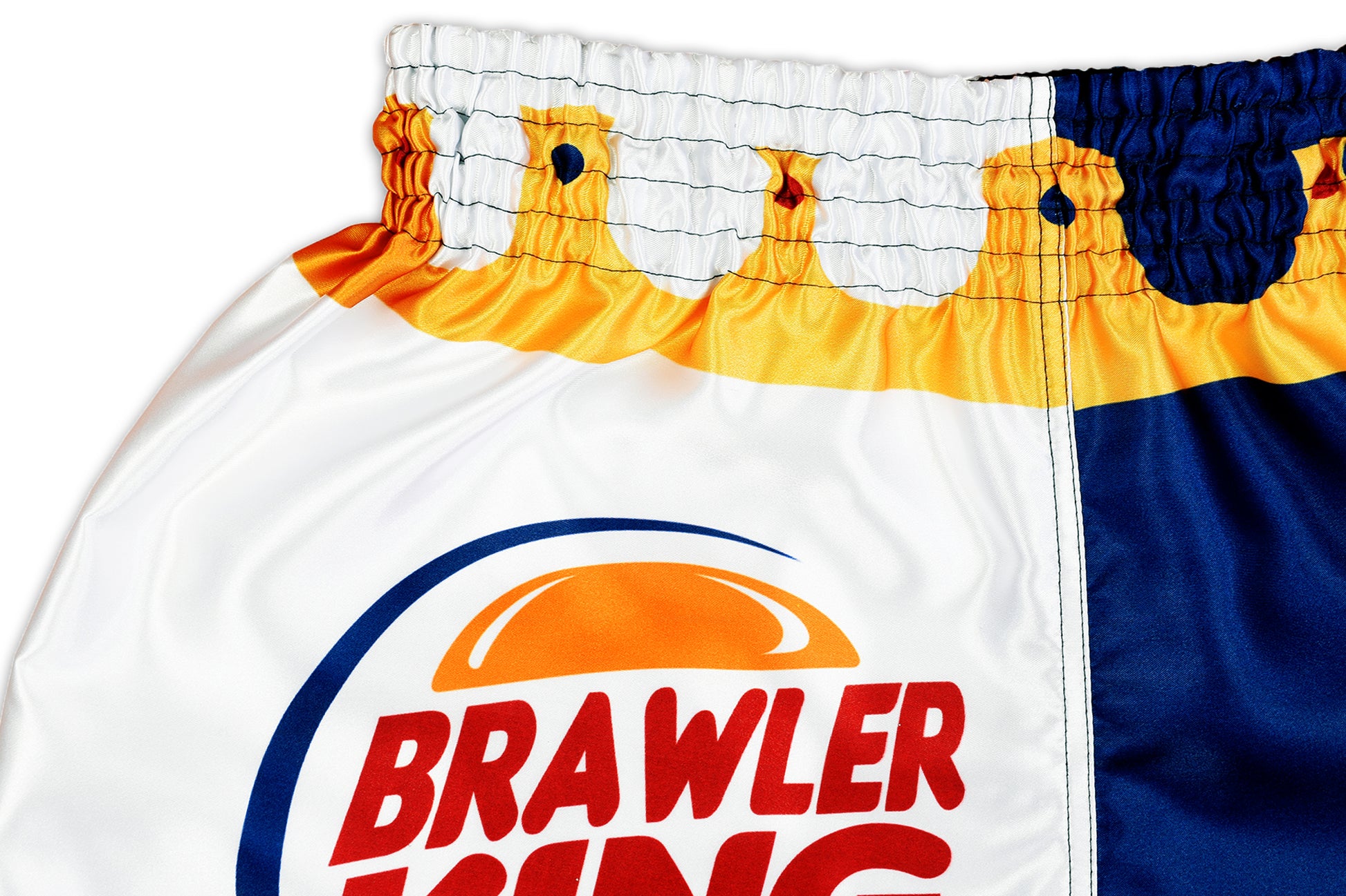 Close up of Brawler King Muay Thai Shorts logo and premium satin waistband