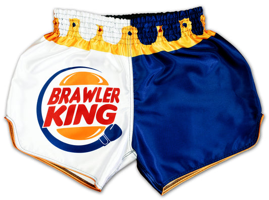 Brawler King Muay Thai Shorts in blue and white with a golden crown around the waist and bold comic style logo