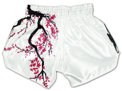 Back view of Cherry Blossom Samurai Thai boxing shorts in clean white satin with an elasticated waistband and flowing pink cherry blossom branches stretching across the left side