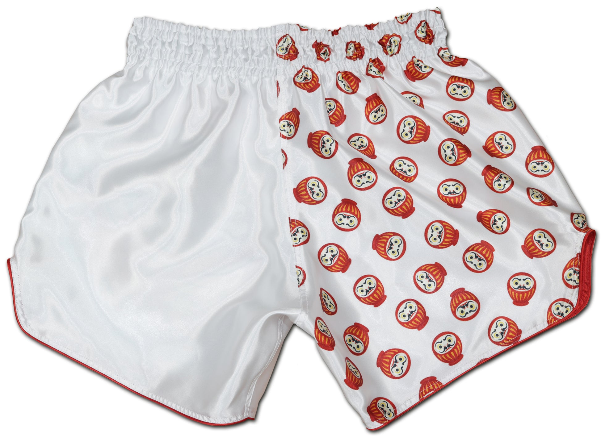 Back view of white DARUMA kickboxing shorts with all-over red daruma doll print on smooth satin fabric