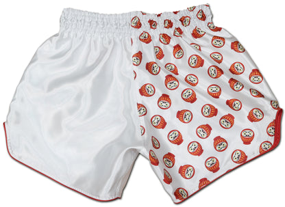 Back view of white DARUMA kickboxing shorts with all-over red daruma doll print on smooth satin fabric