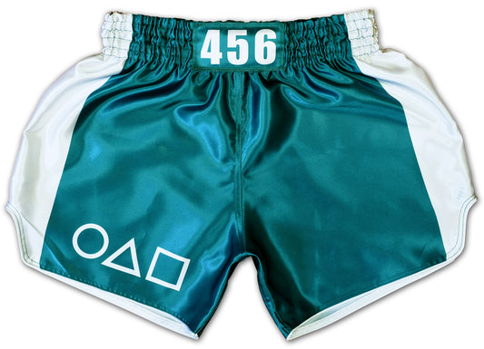 Muay Thai training shorts 456 in teal green and white satin with minimalist circle triangle square symbols on the front panel
