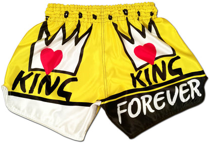 KING Forever boxing trunks back view, yellow satin with black crown, KING lettering and FOREVER across black bottom panel