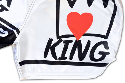 Close up of satin fabric and crown artwork on KING Forever Muay Thai Boxing Shorts in white