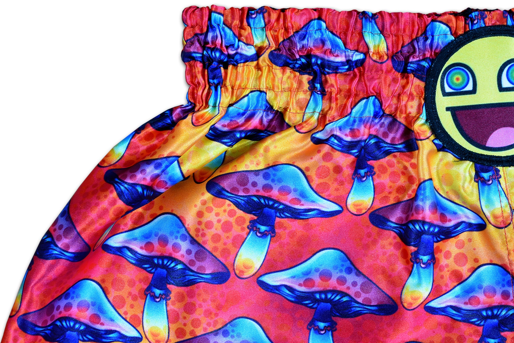 Detail of Magic Mushroom Muay Thai Shorts waistband with psychedelic mushroom details and smiley patch