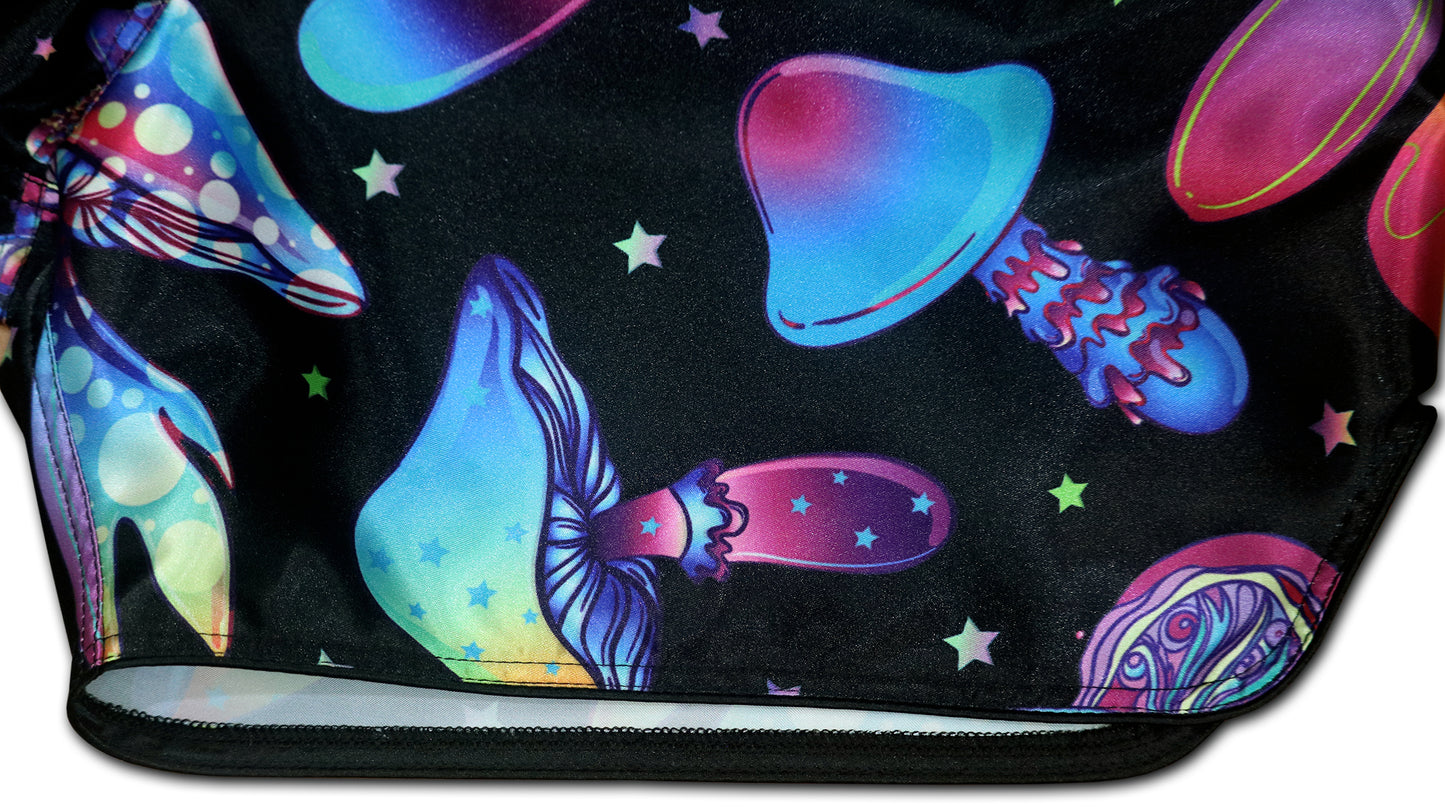 Close up of Magic Mushrooms Muay Thai Shorts with psychedelic mushroom artwork and neon colors on black satin