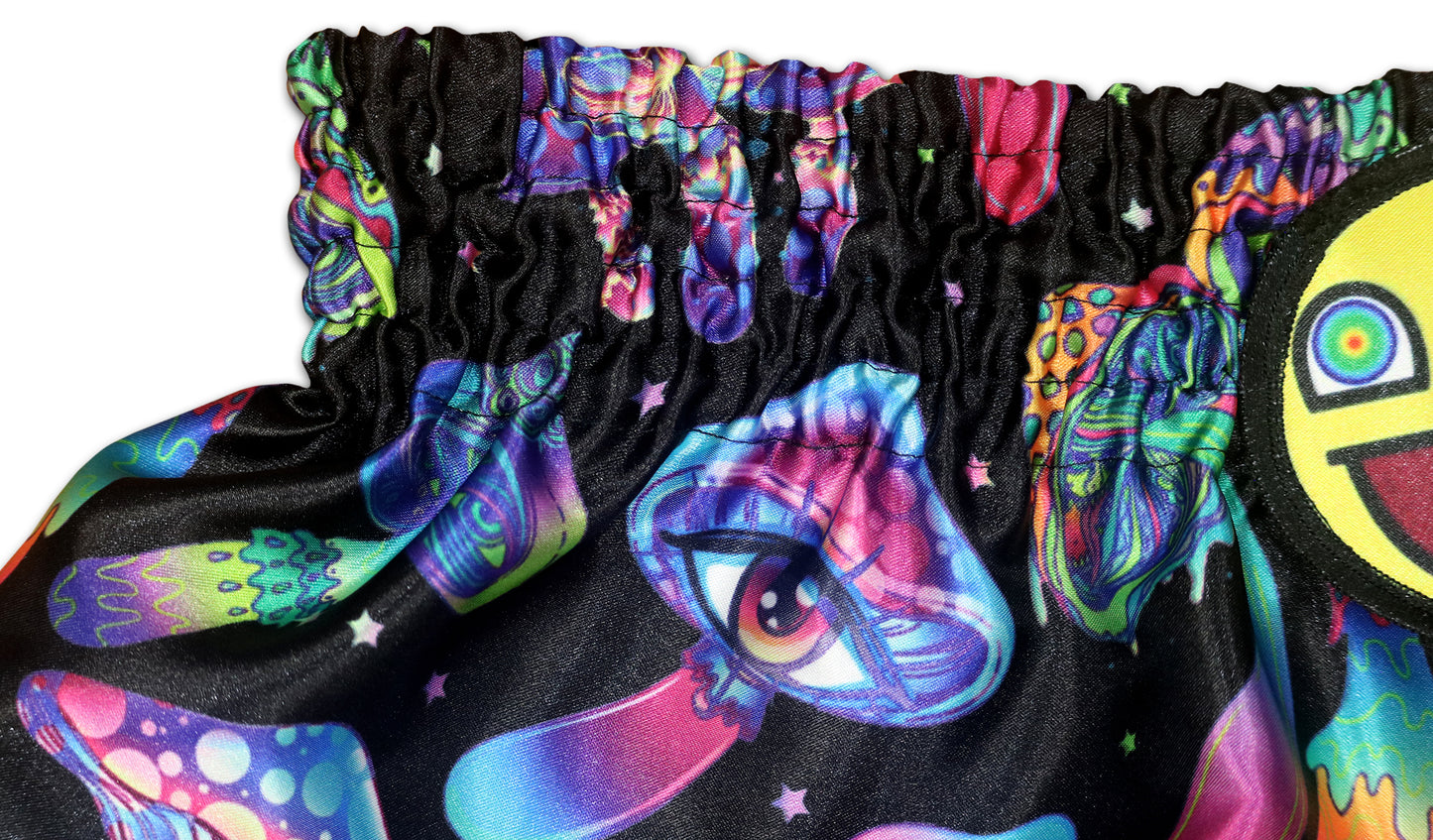 Detail of Magic Mushrooms Muay Thai Shorts waistband with psychedelic mushroom artwork and smiley patch