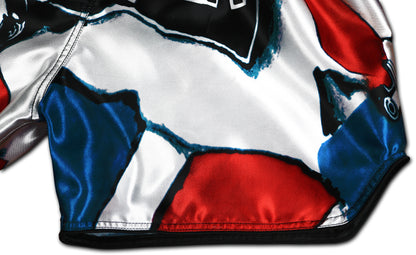 Patriot Muay Thai Shorts detail showing red white and blue satin fabric with reinforced seams and elaborately processed borders