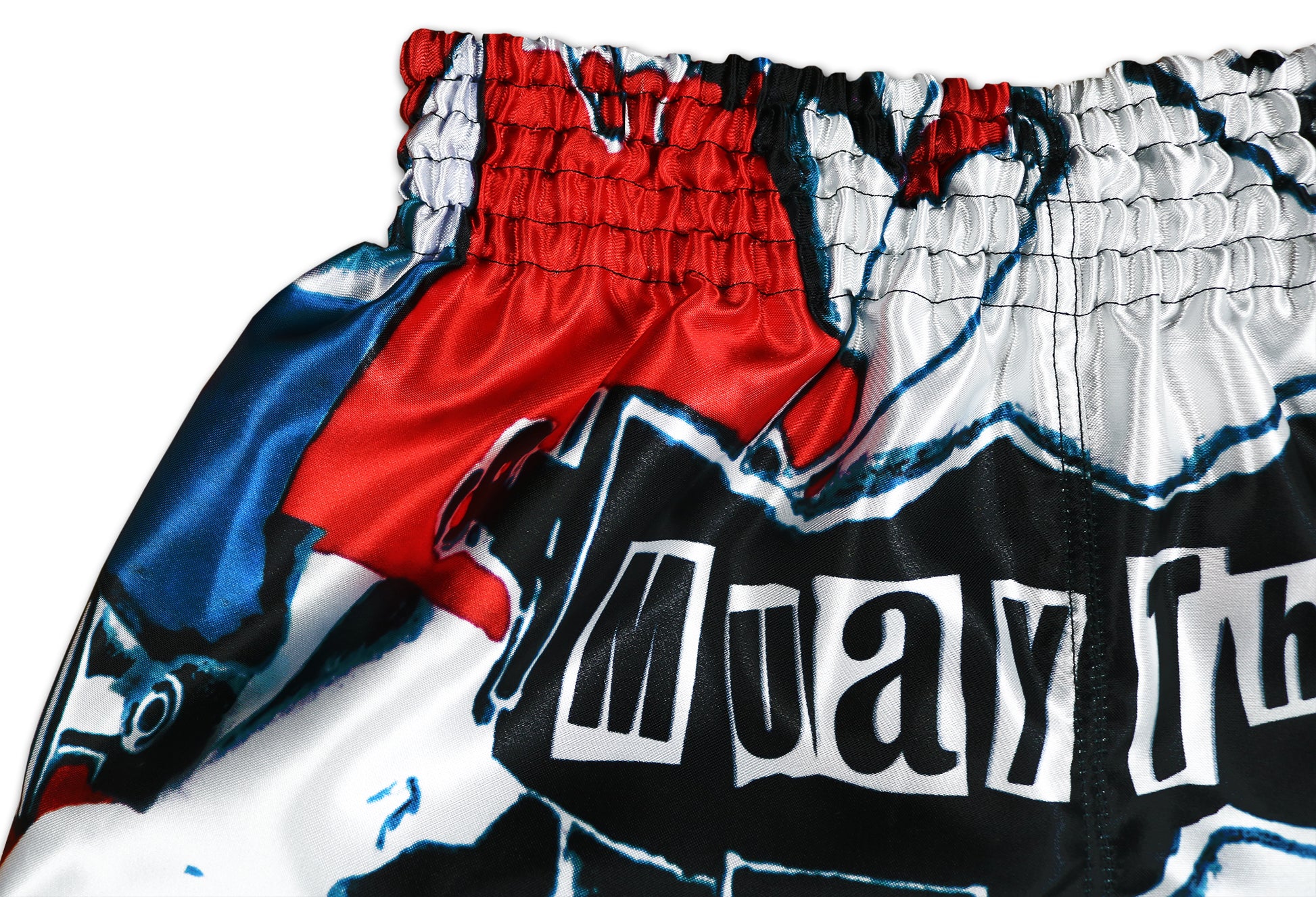 Patriot Muay Thai Shorts detail showing red white and blue waistband with Muay Thai script and premium sublimation print