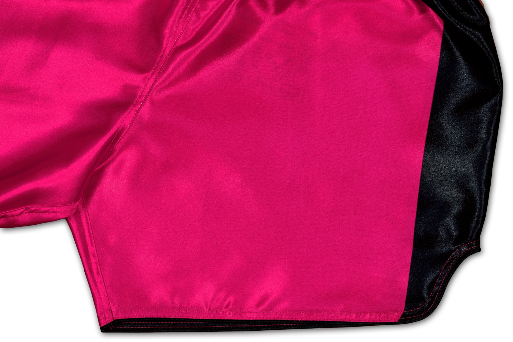 Detail of black side panels, satin fabric and reinforced stitching on Pink Soldier fight shorts