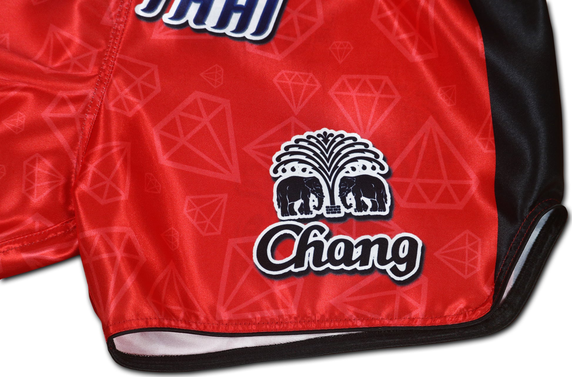Detailed view of Chang elephant logo and diamond pattern on Red Corner Muay Thai Boxing Shorts