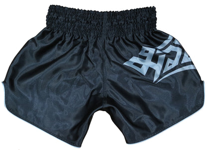 Back view of Samurai Tribal kickboxing shorts in black satin with bold silver gray tribal Muay Thai logo on side panel