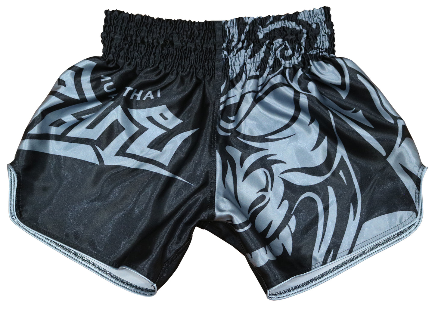 Front view of Samurai Tribal Muay Thai boxing shorts in silver gray and black with tribal samurai mask graphic and bold MUAY THAI tribal lettering