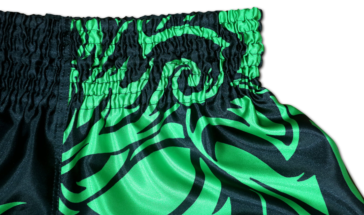 Close up of black elastic waistband and toxic green tribal pattern on Samurai satin training shorts