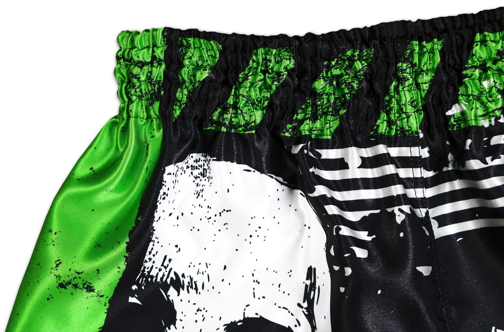 Special Forces Fight Shorts detail view  showing elastic waistband, green satin, skull graphic and stitching.