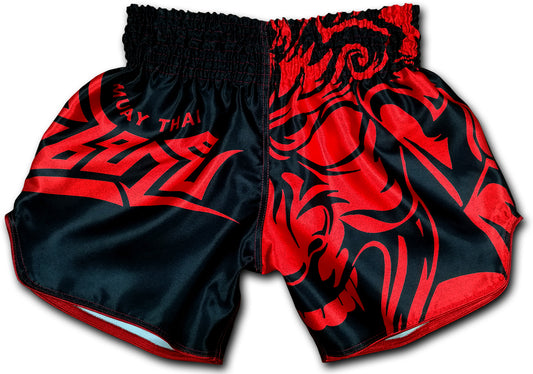Front view of Tribal Samurai Muay Thai boxing shorts in black and red featuring a bold blood red oni demon mask graphic and tribal lettering on glossy satin