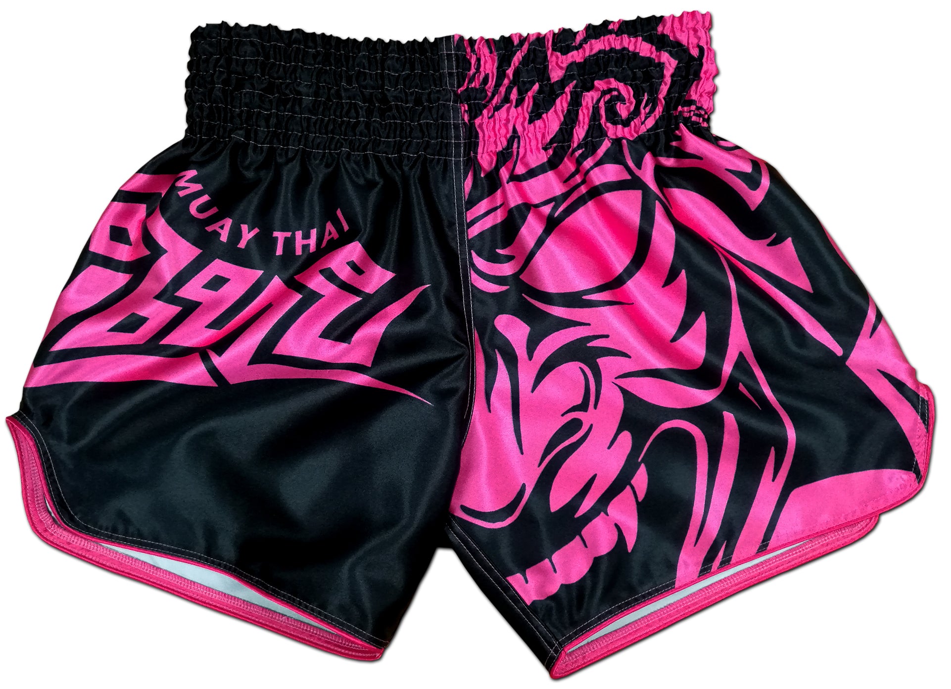 Front view of women's Tribal Samurai Thai boxing shorts in black and pink with a bold neon pink oni demon mask graphic and tribal lettering on glossy satin