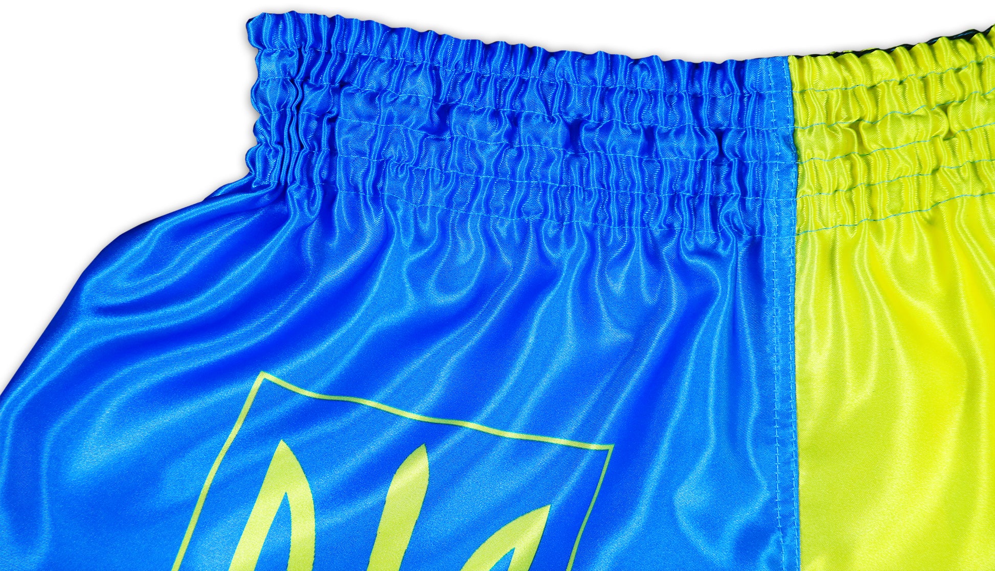 Close-up of glossy satin texture and elastic waistband on blue and yellow Ukraine Fight Shorts