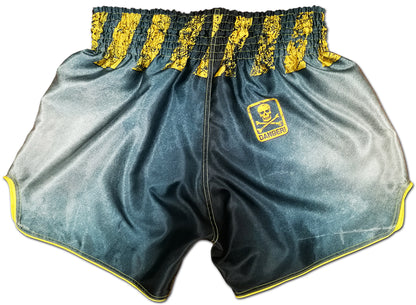 Back view of gray and yellow Thai boxing shorts with yellow skull and crossbones DANGER badge