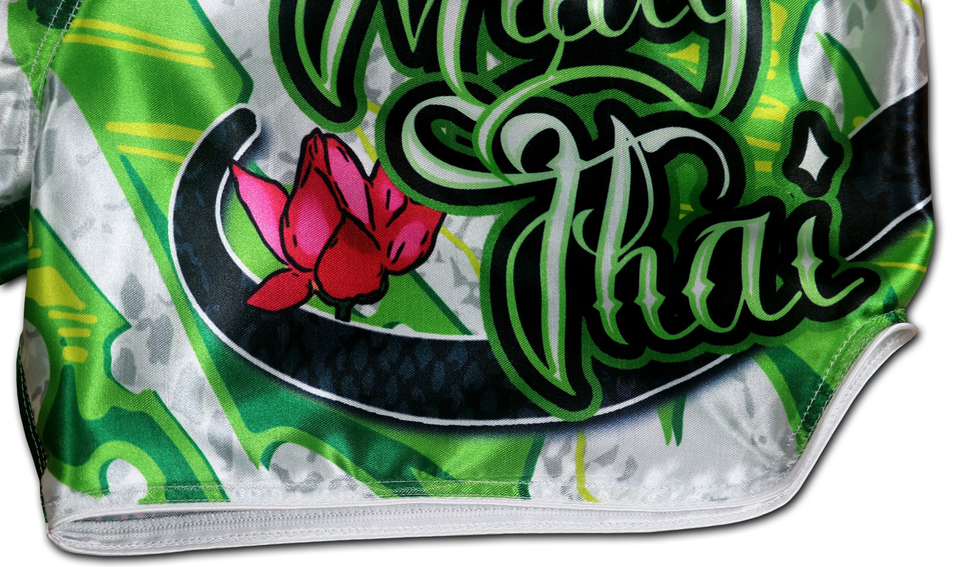 White Cobra Muay Thai Boxing Shorts detail - Muay Thai script with lotus blossom and cobra scales