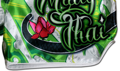 White Cobra Muay Thai Boxing Shorts detail - Muay Thai script with lotus blossom and cobra scales