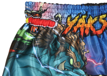 Detail of YAKSHA flame logo and elastic rubber waistband on Street Fighter shorts