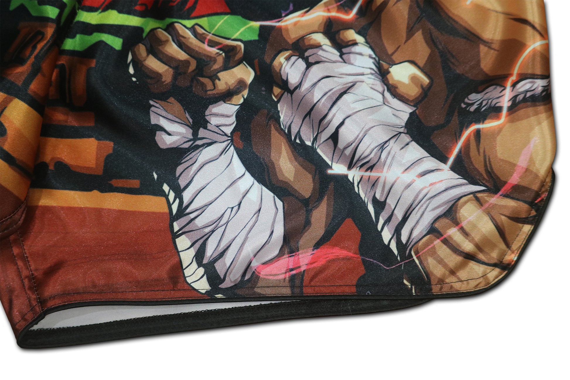Detail of bandaged fists artwork and pink lightning print on YAKSHA Street Fighter fight shorts